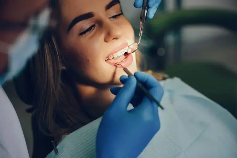 Limestone Hills Orthodontics doctor or staff assisting a patient with a comfort or emergency repair. Warm, reassuring tone. Convey calm and competence.