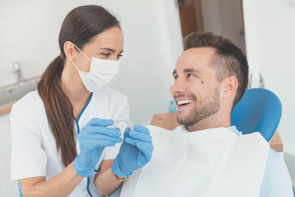 denstist shows invisalign clear aligners - How Orthodontic Insurance Works in Austin, TX 
